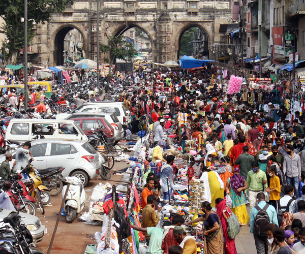 Crowded street filled with people and cars