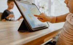 Child learning on a tablet at home