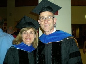 Professors De Vivo and Kraft get ready to march in the commencement ceremony.