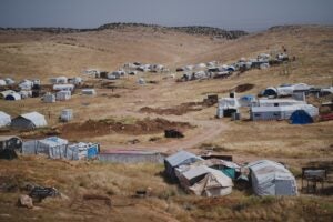 Line of tents in an arid environment