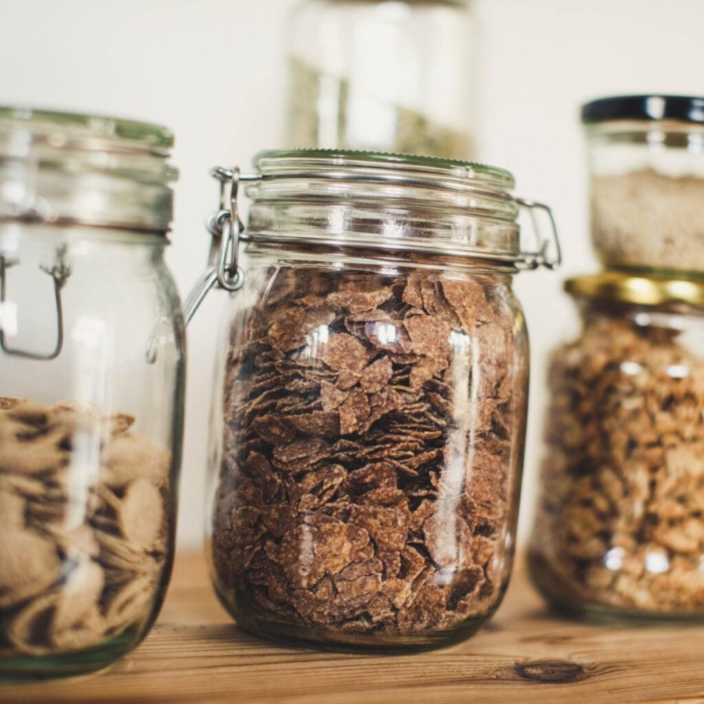 Cereals and muesli in glass jars.