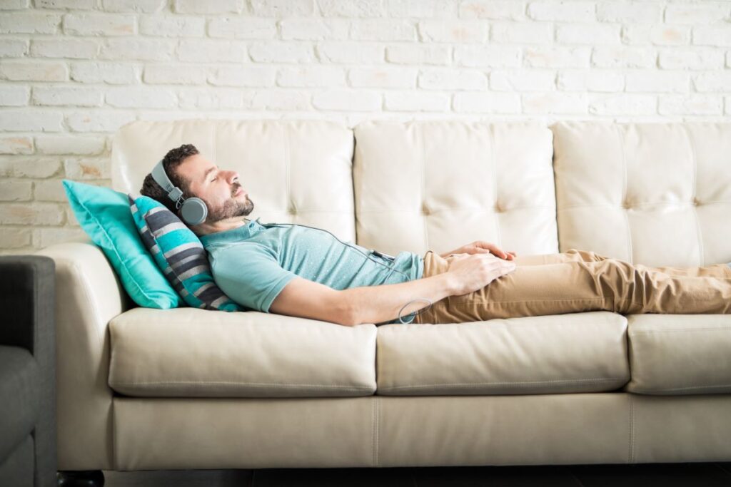 man lying on sofa