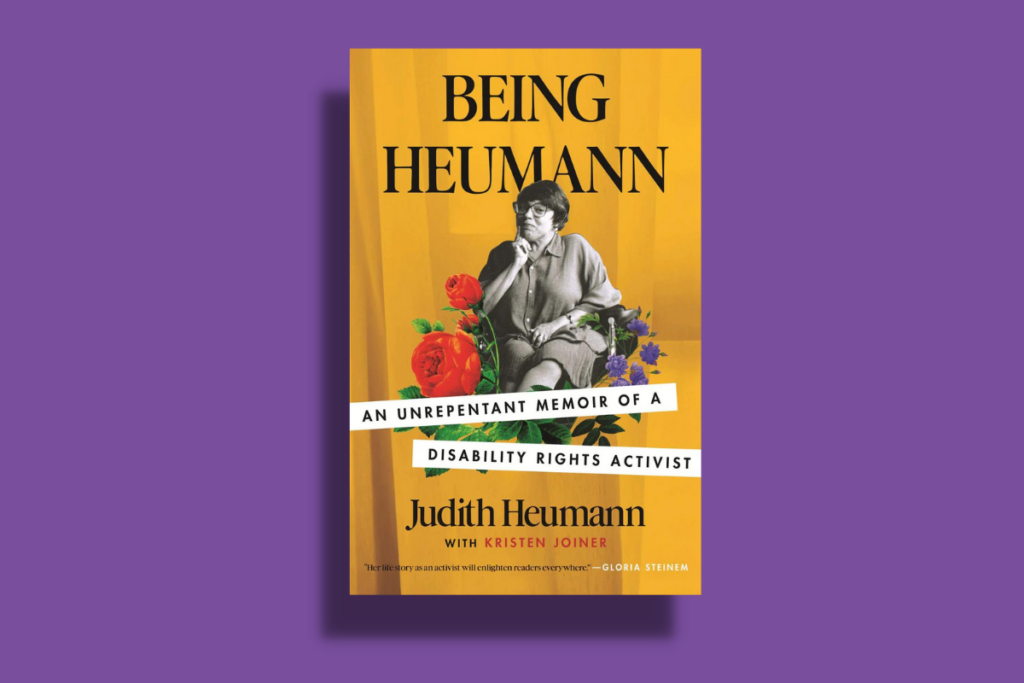 Yellow cover image of the book "Being Heuman" by Judith Heumann in front of a purple background.