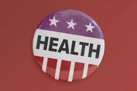 Image of pin with US flag and word "health"