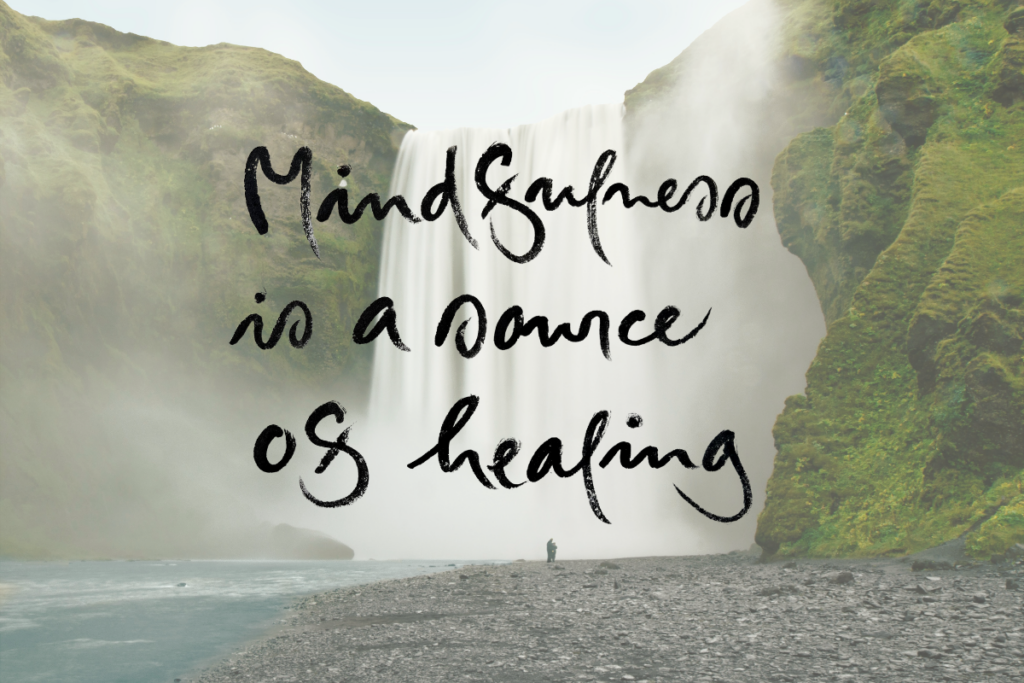 Text "Mindfulness is a Source of Healing" over a large waterfall