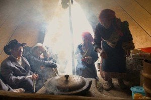 Nomadic villagers burning yak dung