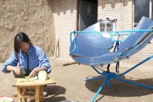 Woman in Qinghai,China preparing noodle soup