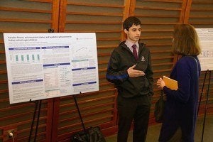 Student Ishaan Desai presents a poster on his research, "Aerobic fitness, micronutrient status, and academic achievement in Indian school-aged children"