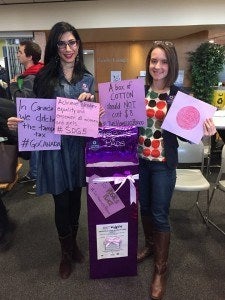 Students show where feminine hygiene products can be donated.