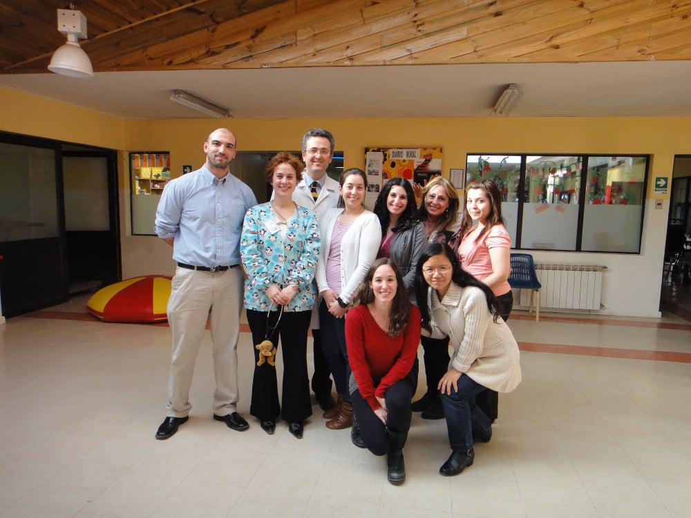 Dr. Xiaoli Chen (extreme right, front row) with some of our collaborators in Punta Arenas, Chile.  Dr. Juan Carlos Velez (back row, white coat) and Dr. Clarita Barbosa (2nd left) are co-investigators on the C-PASS projects.  Ms. Micah Pepper (in red shirt beside Dr. Chen) is the research coordinator.