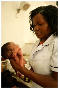 healthworker-holding-baby