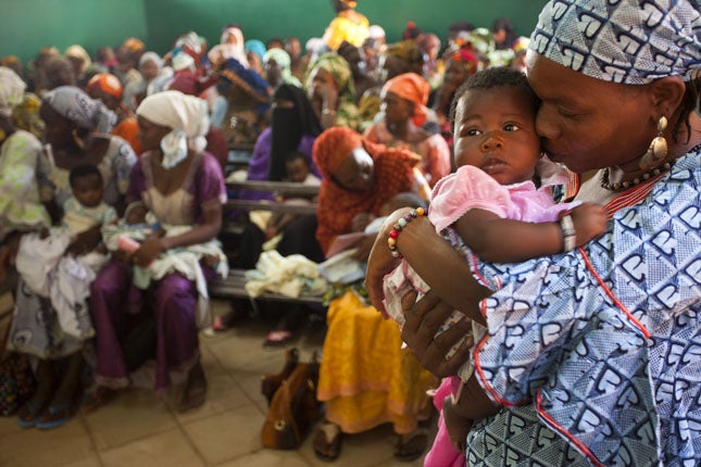 Mothers wait to vaccinate their babies in Bamako, Mali, 