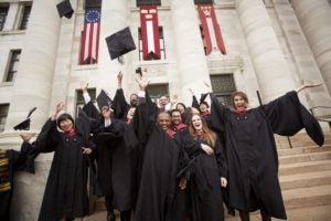 Graduates throwing their caps